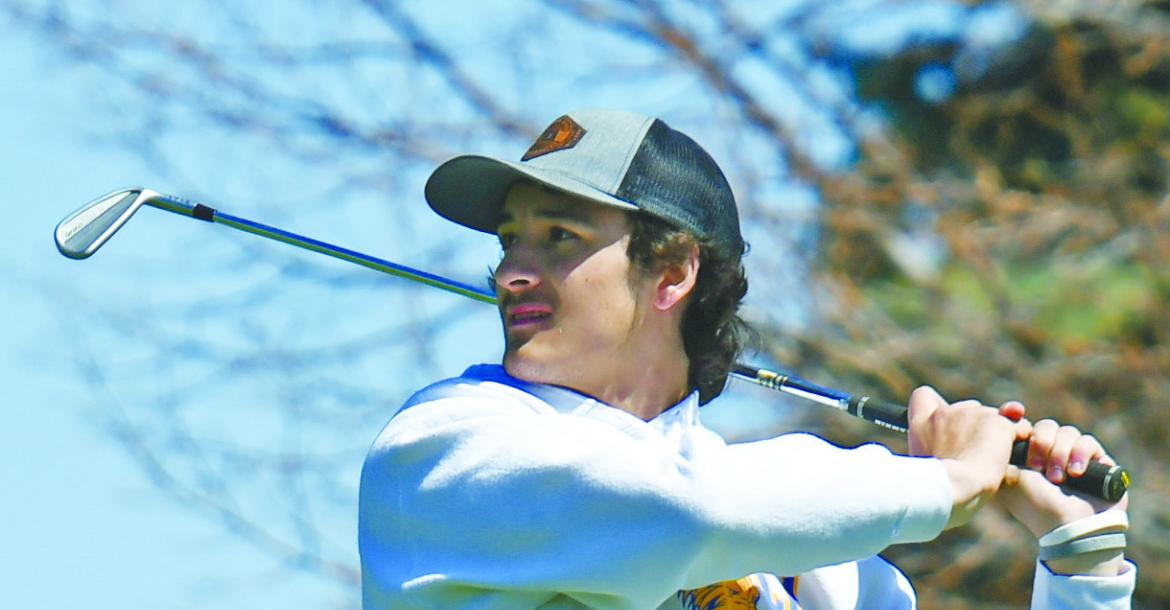 RYDER ANDERSON tees off during last Tuesday’s Kearney Catholic Invite at Meadowlark Hills Golf Course in Kearney.