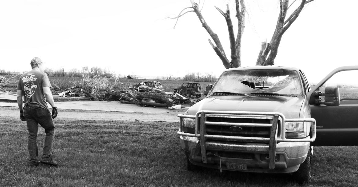 CHAD JACOBSEN surveys the damage to his property west of Elba on Saturday morning after a tornado ripped through his farm the night before. Jacobsen said he was unsure of what his next steps would be. Photos by Michael Rother